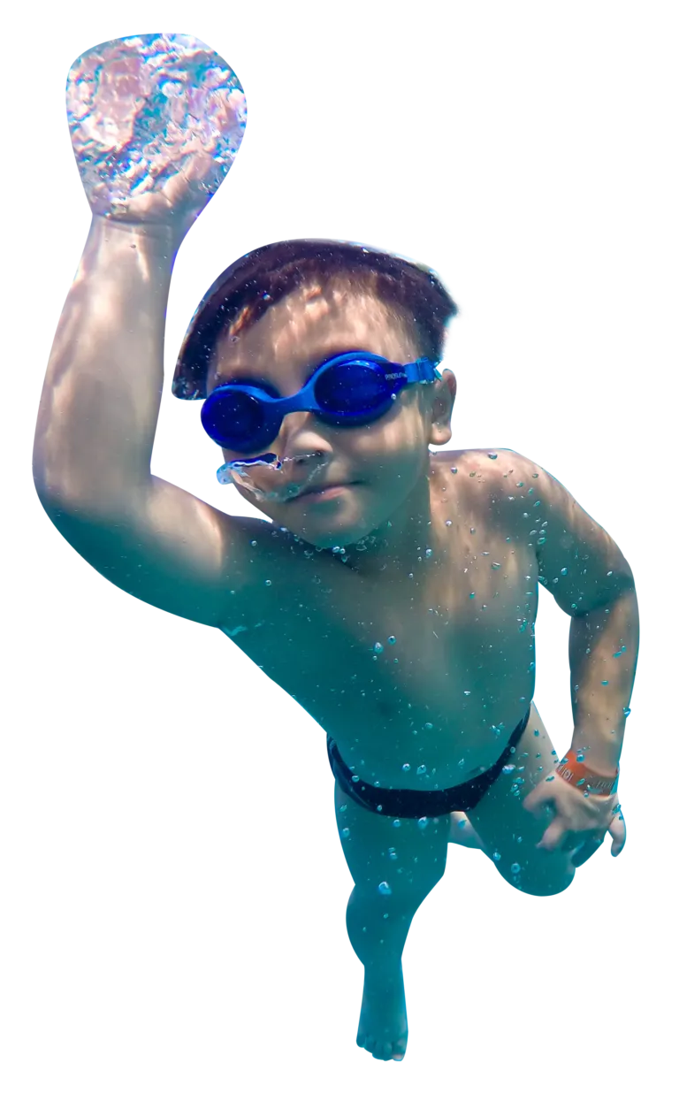 Boy swimming underwater with blue goggles at WeBorn Swim Academy